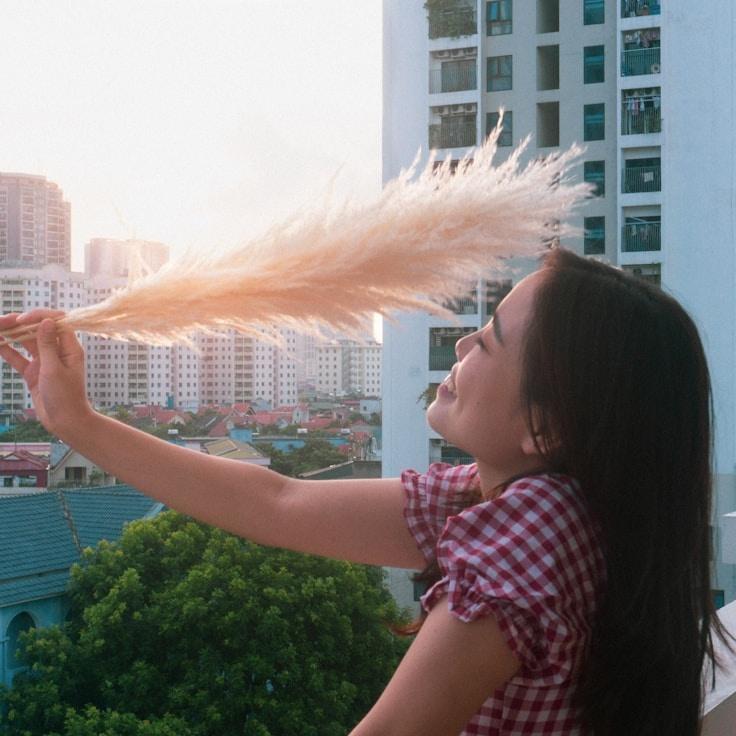 Alex Taylor, Lead Design Curator at Trail Haven Cipher, reviewing corporate floral arrangements